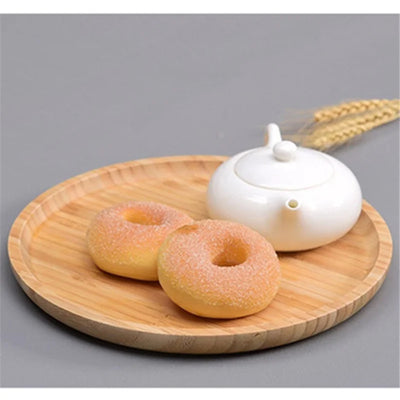 Bamboo Round Serving Tray Eco-Friendly Wooden Board used as a decorative table centerpiece.