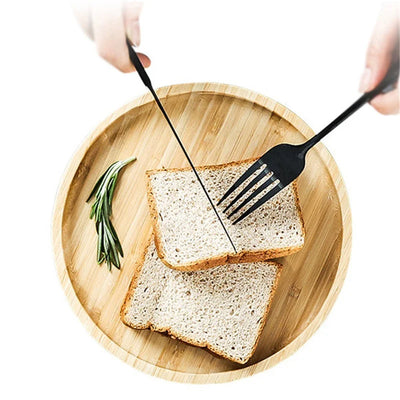 Bamboo Round Serving Tray Eco-Friendly Wooden Board used as a decorative table centerpiece.
