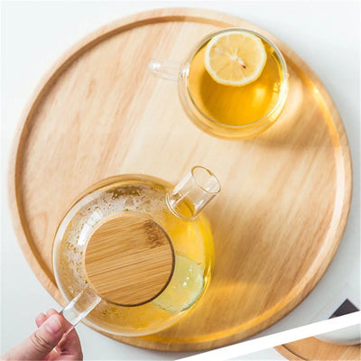 Bamboo Round Serving Tray Eco-Friendly Wooden Board with snacks and drinks displayed in kitchen décor.