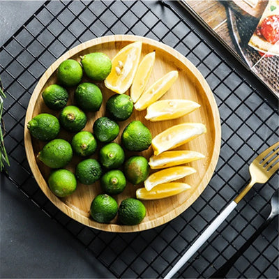 Bamboo Round Serving Tray Eco-Friendly Wooden Board with snacks and drinks displayed in kitchen décor.