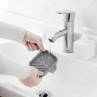 Silicone Sink Tray – Soap & Sponge Holder with Drain being rinsed in a modern kitchen sink.